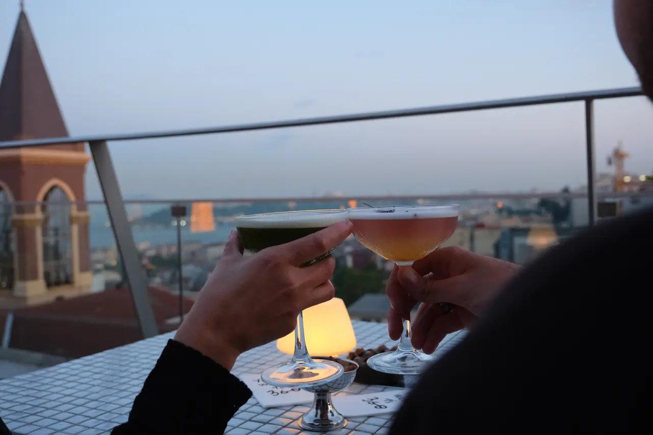 Cocktails on the terrace with Saint Antoine Church and the Golden Horn behind